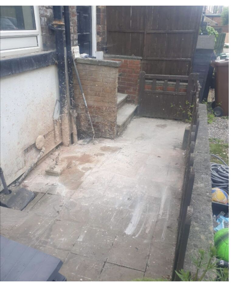 The same back yard swept clean